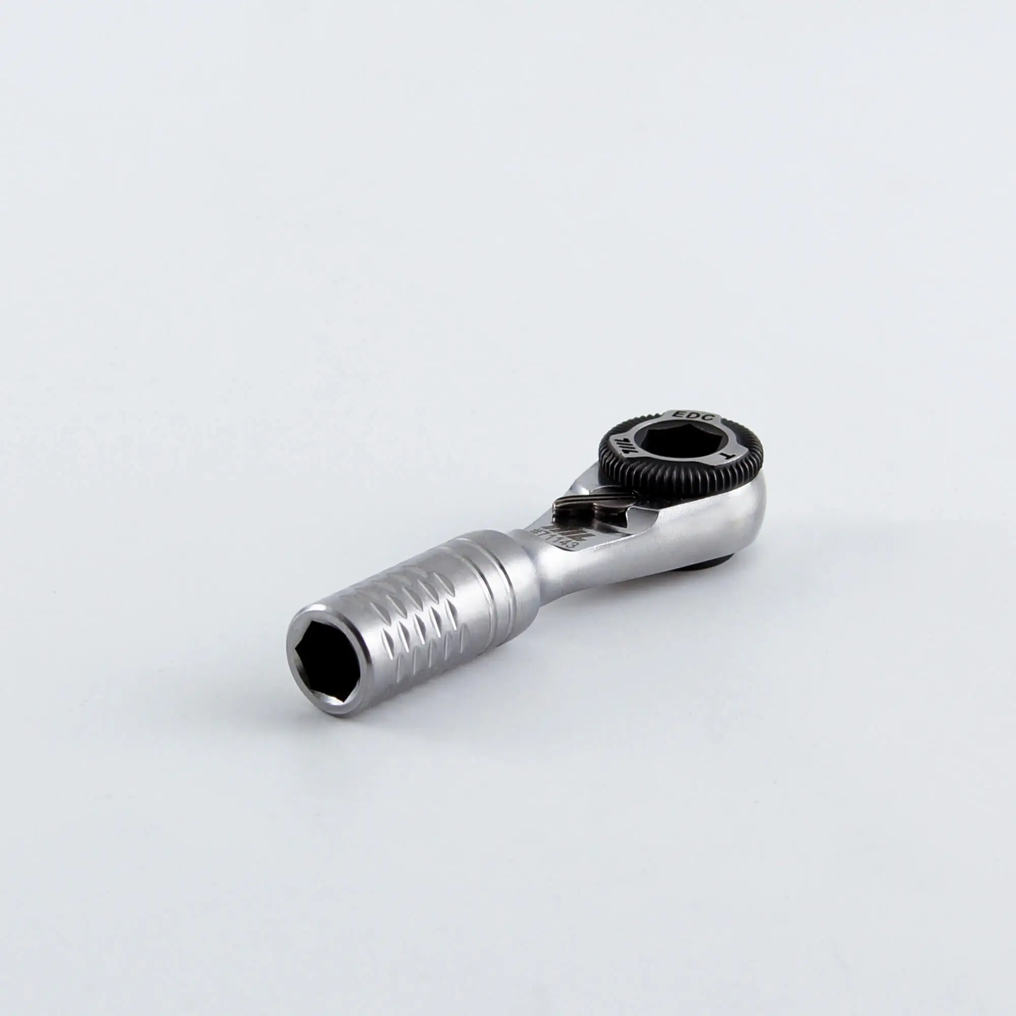 Angled view of the 711L Mini Ratchet Wrench TG lying flat on a white surface